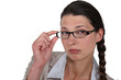 Woman adjusting her glasses