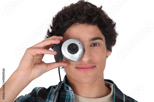 Photo: Young man with a webcam Young man with a webcam