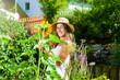 Woman gardener standing in the garden