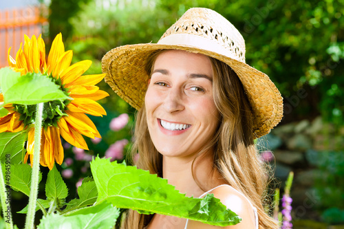 Photo: Woman standing in the garden Woman standing in the garden