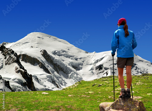 Photo: girl looking at the Mont Blanc in the Savoy Alps - France girl looking at the Mont Blanc in the Savoy Alps - France
