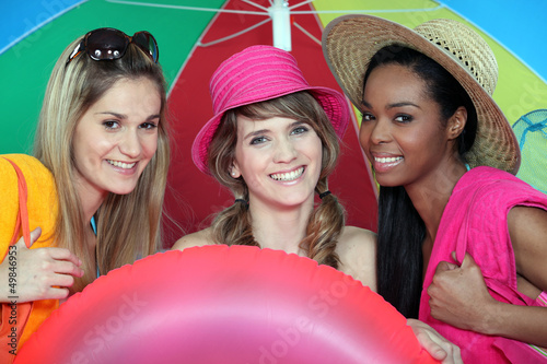 Photo: Young women at the beach together Young women at the beach together