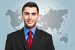 Smiling businessman with the world on the background