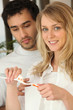 Couple brushing their teeth