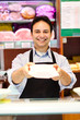 Shopkeeper serving a costumer