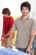 Man ironing shirt