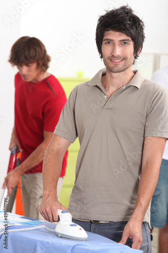 Photo: Man ironing shirt Man ironing shirt