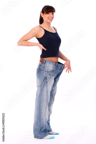 Photo: Happy woman in oversized jeans Happy woman in oversized jeans
