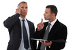 Executives with phone in hand folder