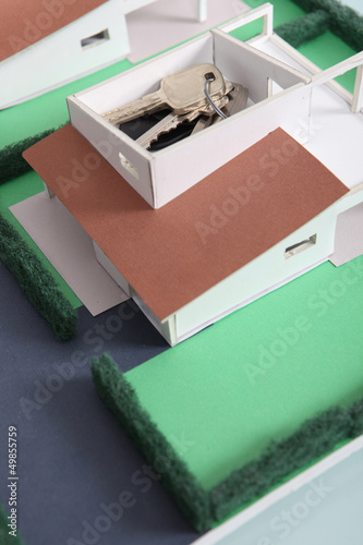 Photo: House keys on model housing project House keys on model housing project