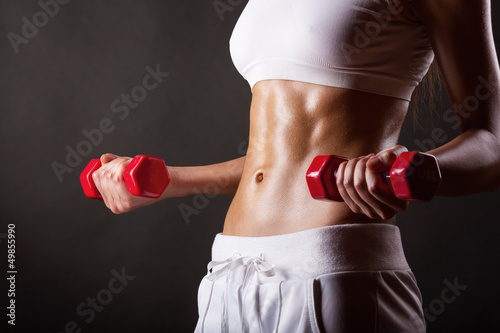 Photo: Woman with dumbbells Woman with dumbbells