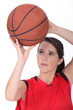 Girl throwing basketball