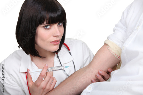 Photo: Doctor with needle Doctor with needle