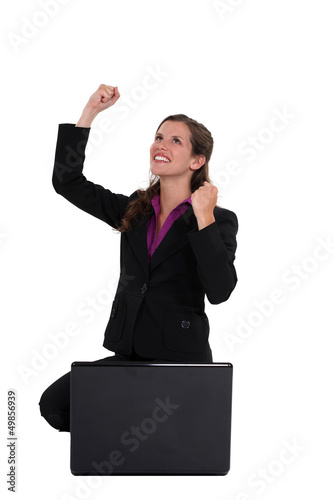 Photo: Excited businesswoman with laptop Excited businesswoman with laptop