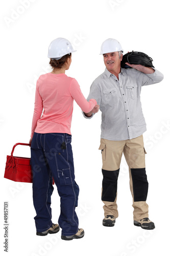 Photo: Electricians shaking hands Electricians shaking hands