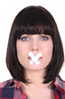 Photo: woman with a scotch tape on her mouth woman with a scotch tape on her mouth