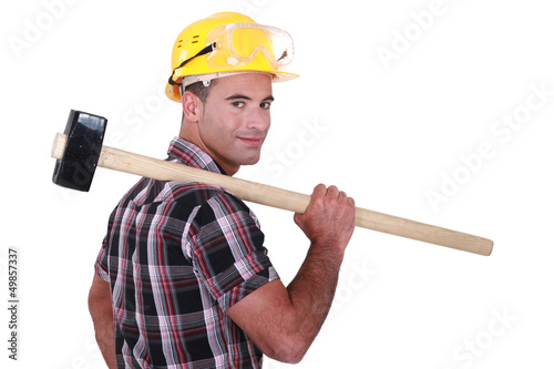 Photo: Builder with a sledgehammer Builder with a sledgehammer