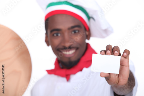 Photo: pizza chef holding a business card pizza chef holding a business card