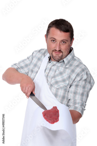 Photo: butcher holding fresh meat butcher holding fresh meat