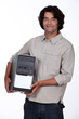 man holding a computer tower