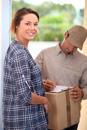 Photo: Woman receiving package Woman receiving package