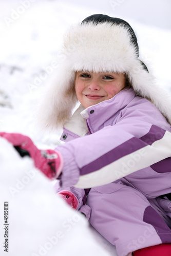 Photo: portrait of little girl at ski resort portrait of little girl at ski resort