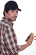 Tradesman holding a multimeter