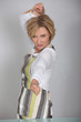 Woman fencing with wooden spoon