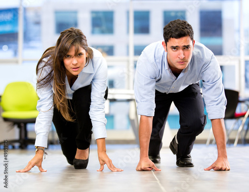 Photo: Business couple racing Business couple racing