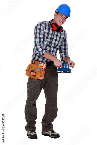 Photo: Workman with a sander Workman with a sander