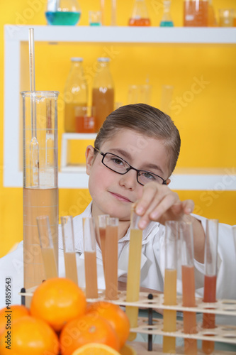 Photo: little girl in a research laboratory little girl in a research laboratory