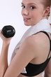 female doing her workout with a dumbbell