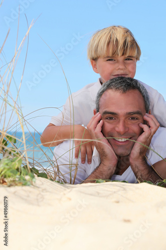 Photo: Father and son at the beach Father and son at the beach