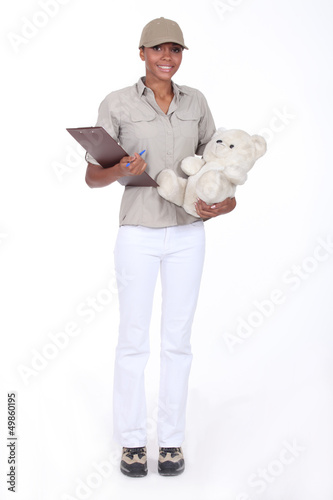 Photo: Woman delivering a teddy Woman delivering a teddy