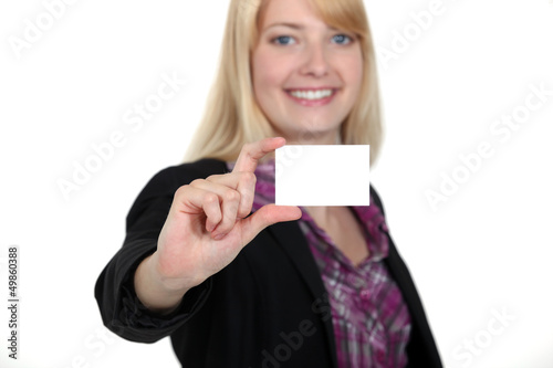 Photo: young businesswoman holding a visit card young businesswoman holding a visit card