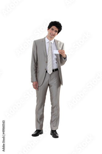 Photo: Man holding business-card Man holding business-card