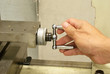 The hand spin the precission wheel on mini lathe machine