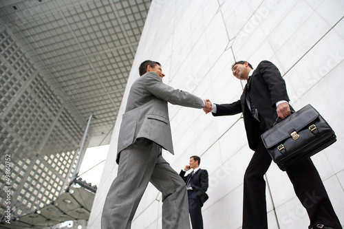 Photo: Businessmen shaking hands outside Businessmen shaking hands outside