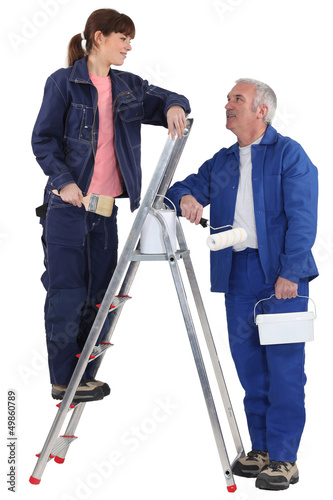 Photo: A painter and his apprentice. A painter and his apprentice.