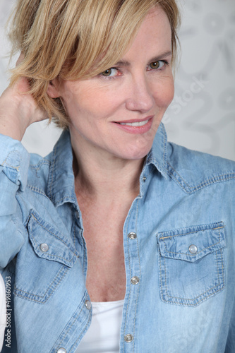 Photo: Woman in a denim shirt Woman in a denim shirt