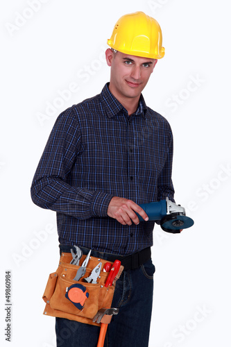 Photo: Tradesman holding an angle grinder Tradesman holding an angle grinder