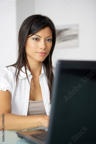 Photo: Brunette doing some work from home Brunette doing some work from home