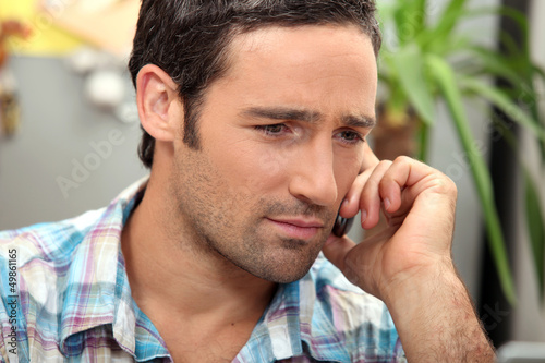 Photo: Man getting bad news Man getting bad news