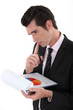Man analyzing pie-chart