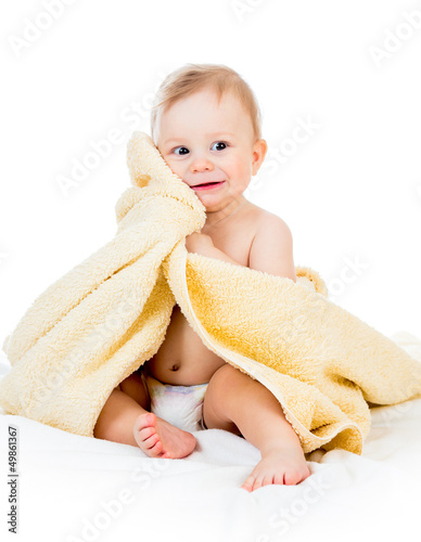 Photo: Adorable happy baby boy in towel Adorable happy baby boy in towel