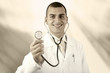 Smiling medical doctor with stethoscope on the hospitals backgro