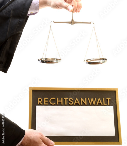 Photo: Rechtsanwalt mit Waage und Schild Rechtsanwalt mit Waage und Schild