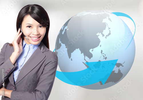 Photo: business woman operator with globe business woman operator with globe