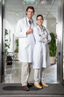 Medical Professionals Standing At Hospital Entrance