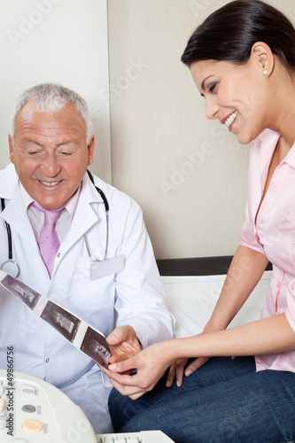 Photo: Radiologist Showing Ultrasound Print To Patient Radiologist Showing Ultrasound Print To Patient